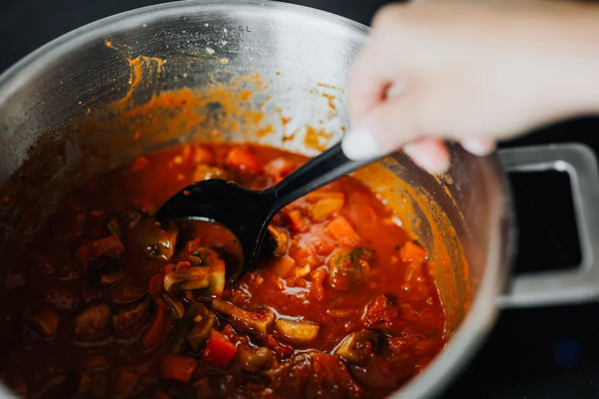 Vegetable stew with tomatoes and spices cooking in a pot