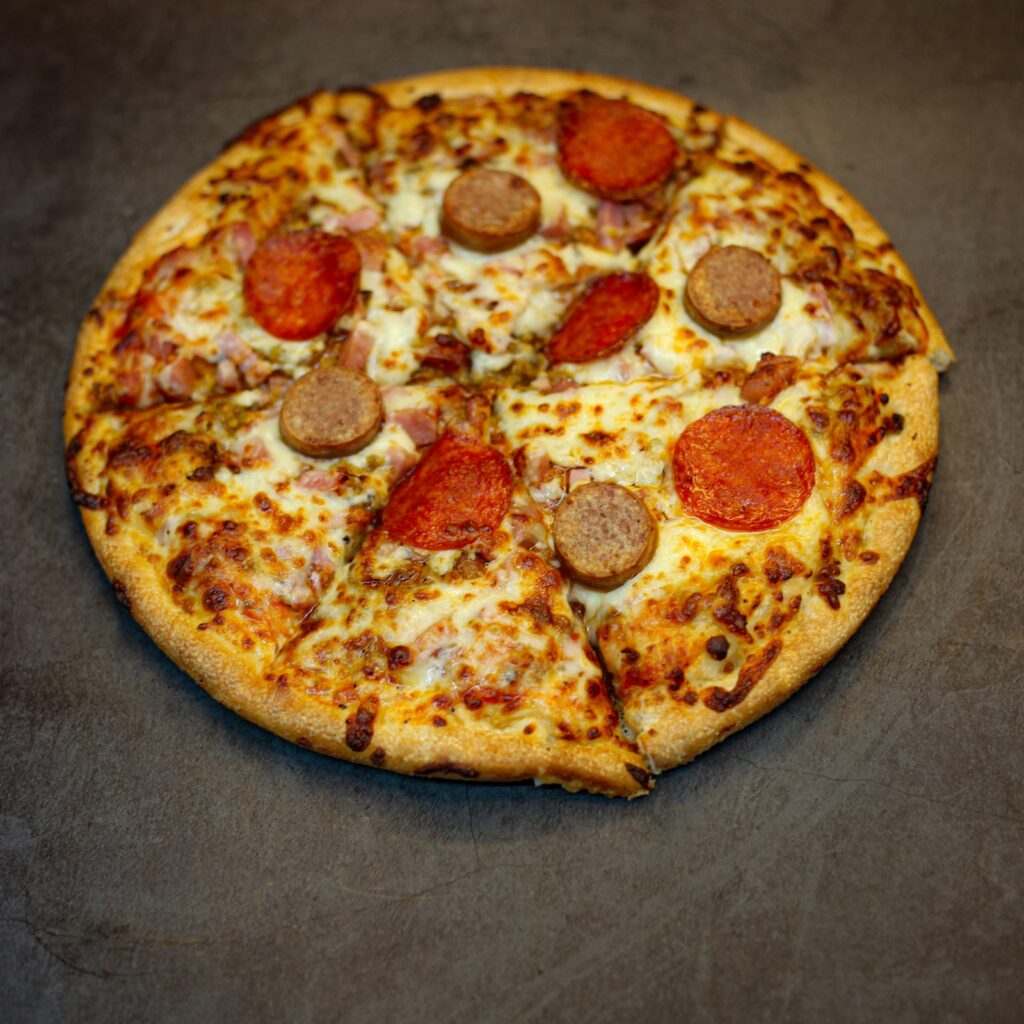 Meat Lovers pizza from Paisa's Pizza loaded with pepperoni and sausage