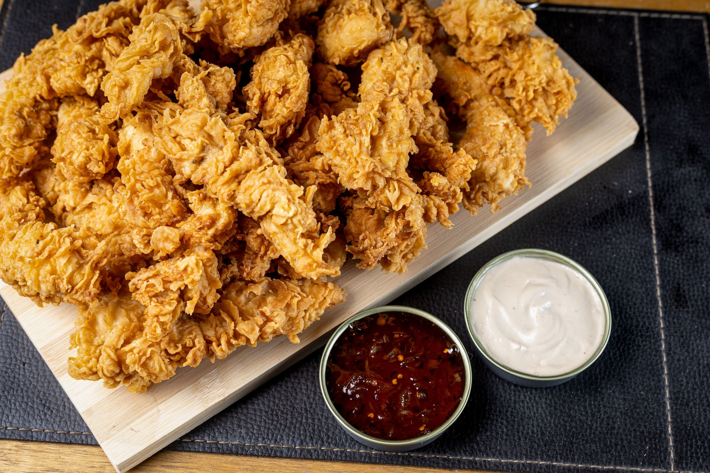 Platter of crispy fried chicken tenders