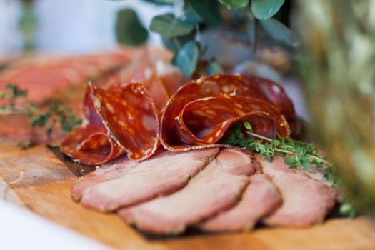 Assorted cured meats on a board