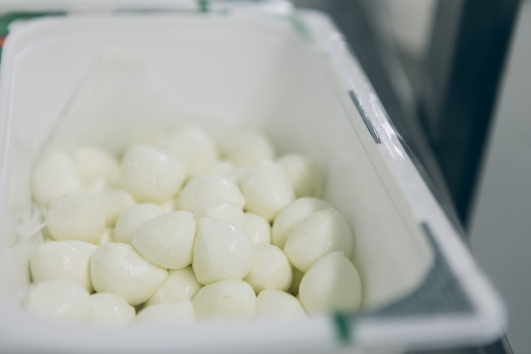 Fresh mozzarella cheese balls in a container