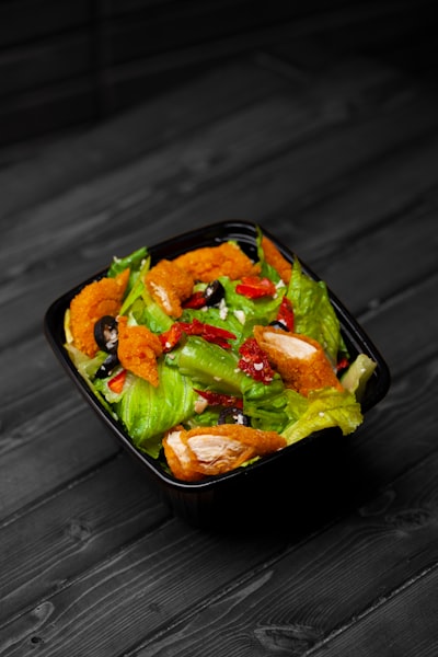 Buffalo chicken salad with breaded chicken and black olives