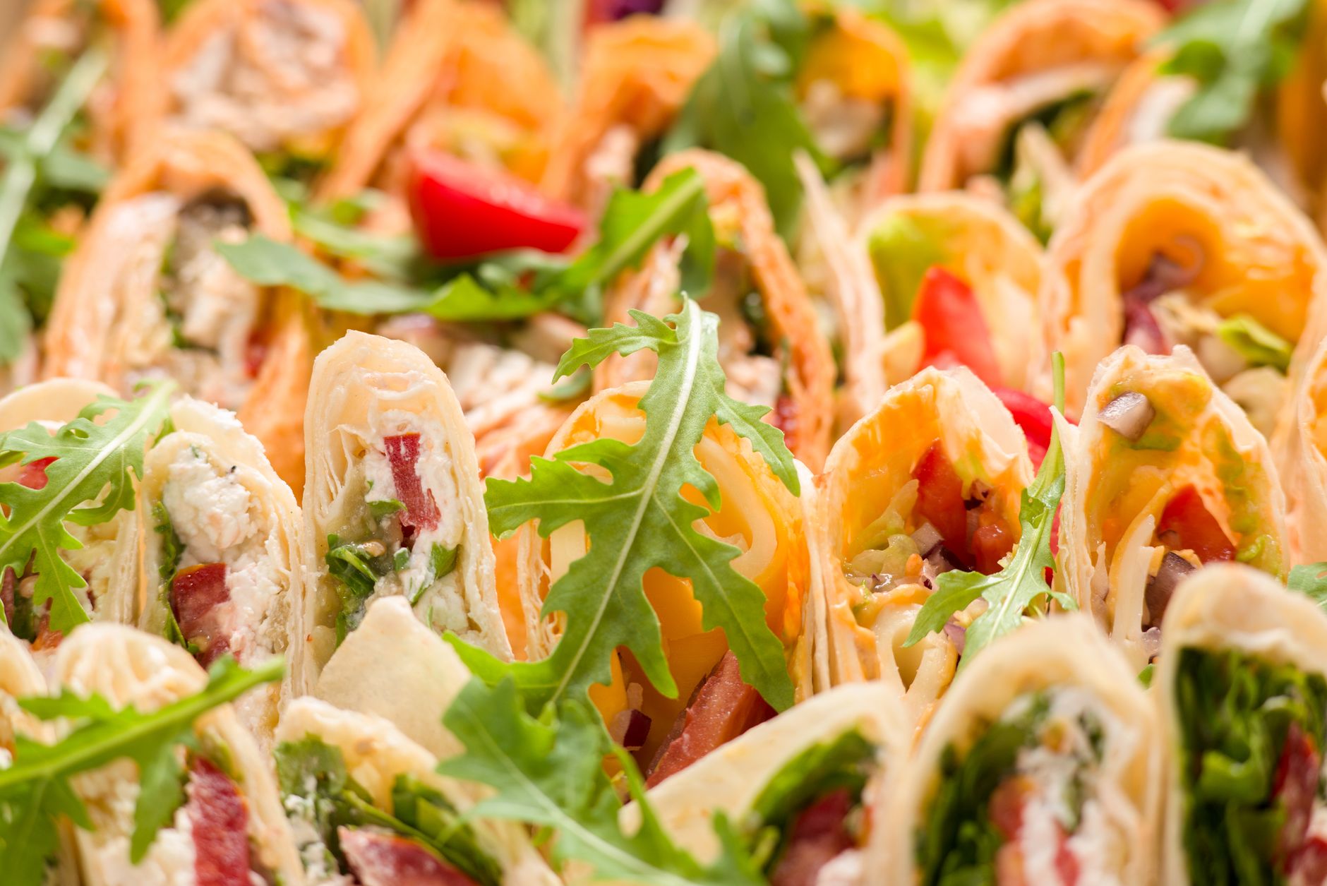 Assorted tortilla wraps filled with vegetables
