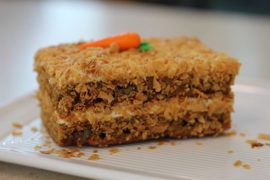 Slice of frosted carrot cake