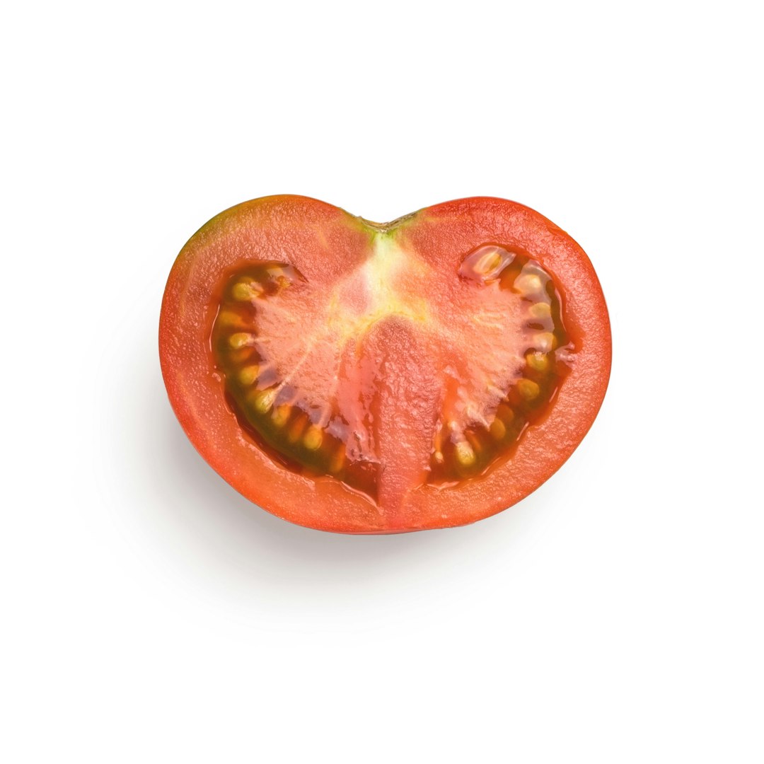 Sliced tomato on a white background