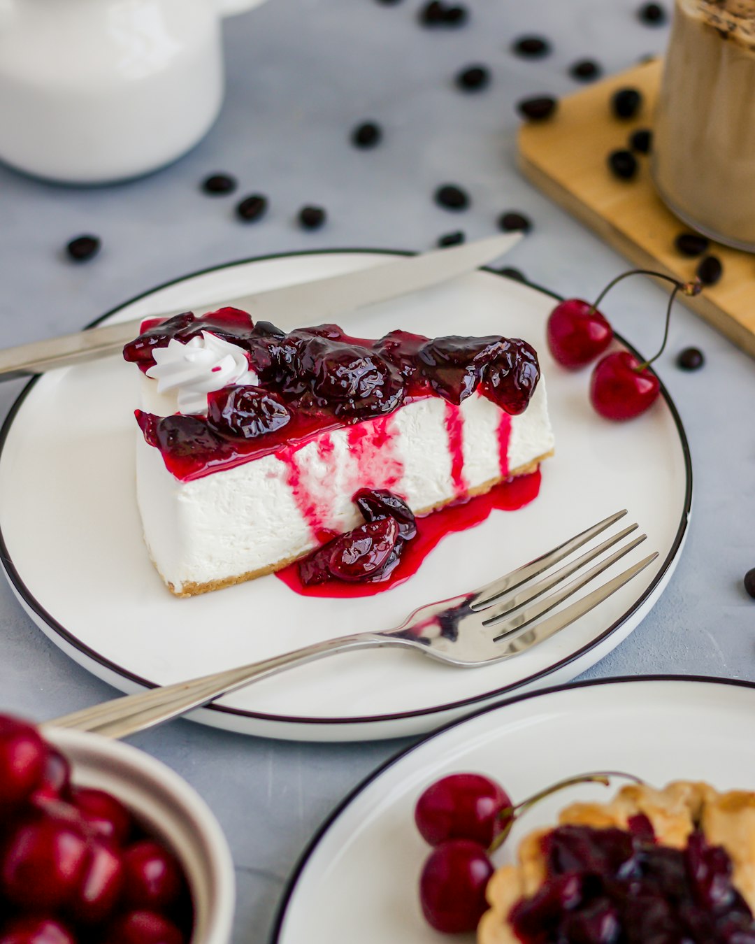 Cheesecake slice topped with cherries