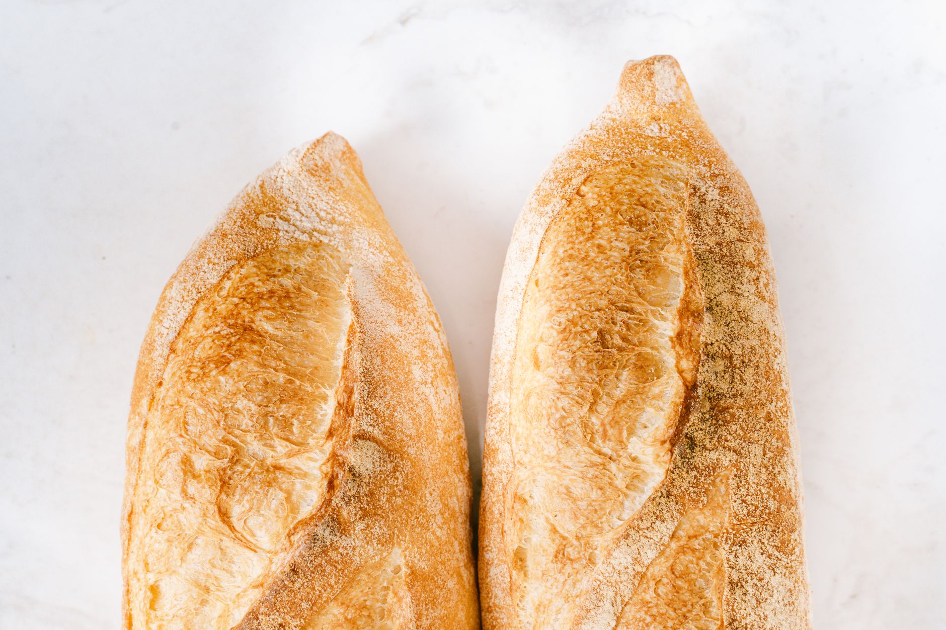 Two freshly baked bread rolls