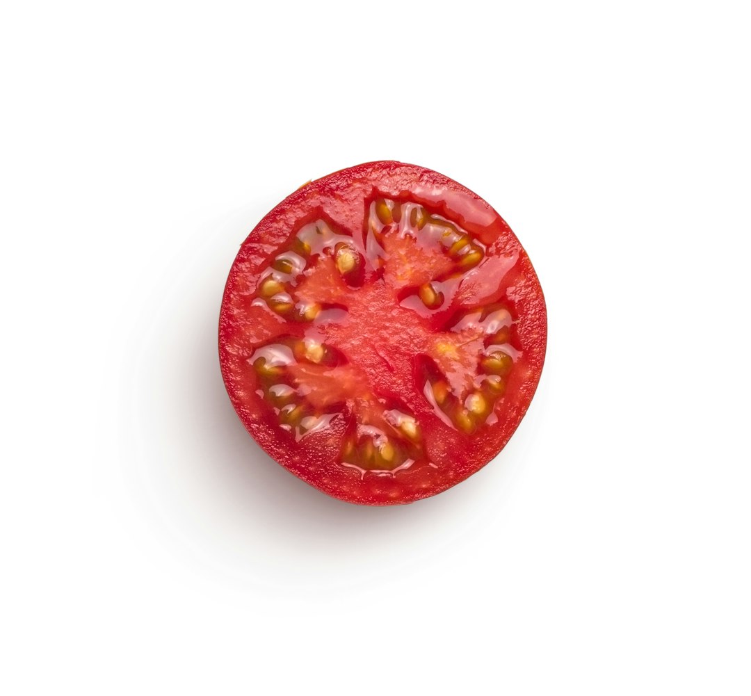 Sliced tomato on a white background