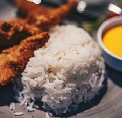 Breaded chicken fingers with rice and honey mustard dip