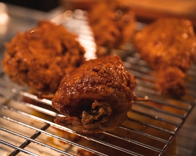 Crispy fried chicken wings on a cooling rack