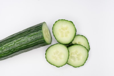 Fresh sliced cucumber on a white background