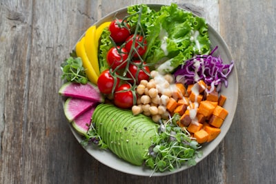 Fresh garden salad bowl with lettuce, tomatoes, and avocado