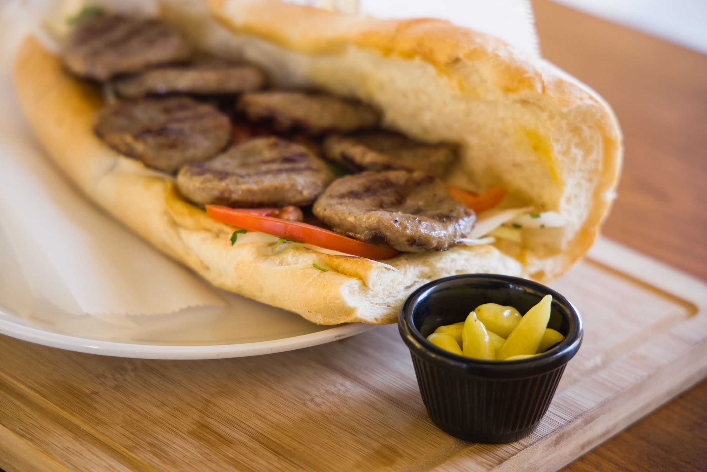 Grilled patty sandwich on a fresh roll