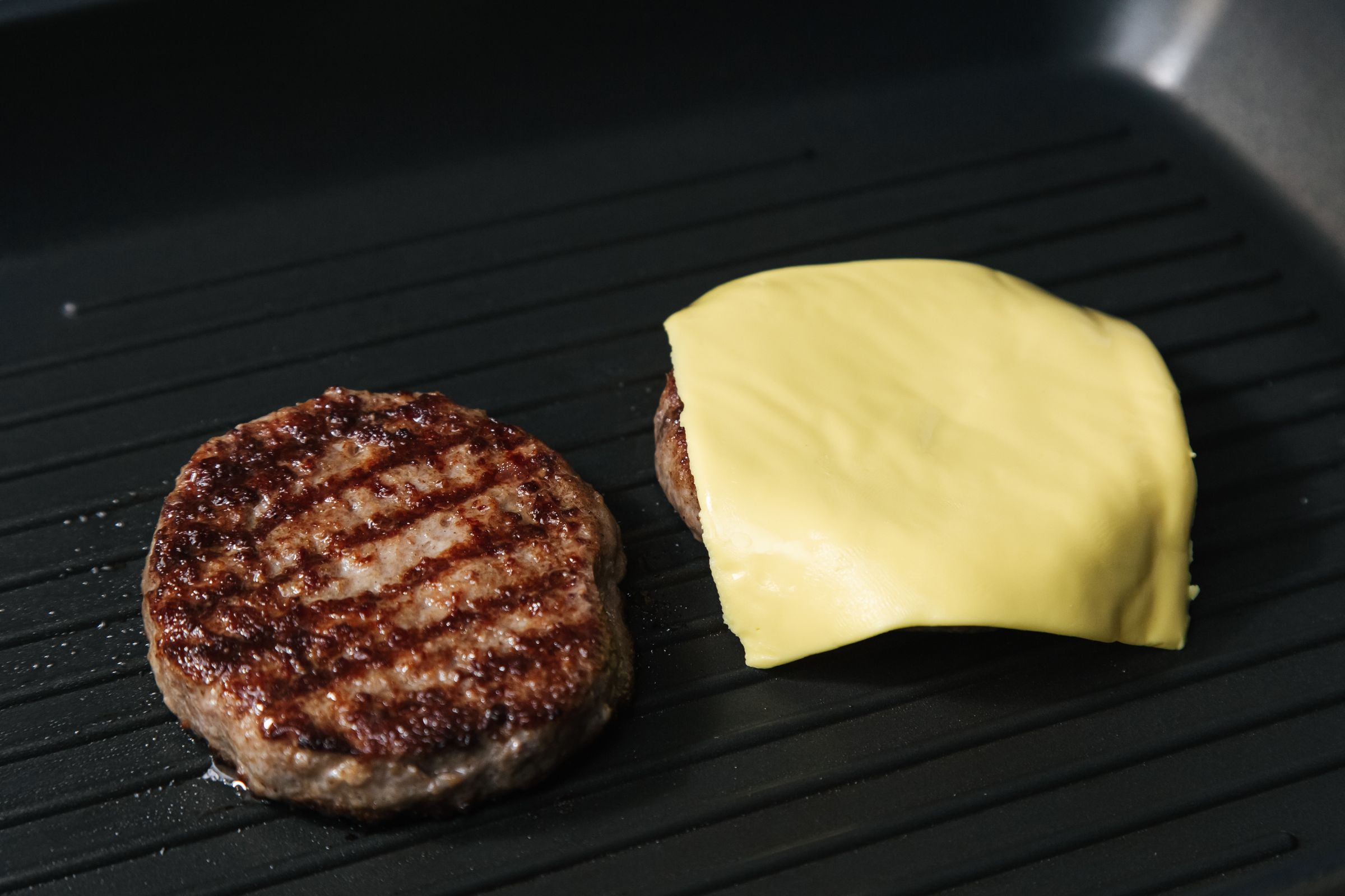 Grilled patty with a slice of melted cheese