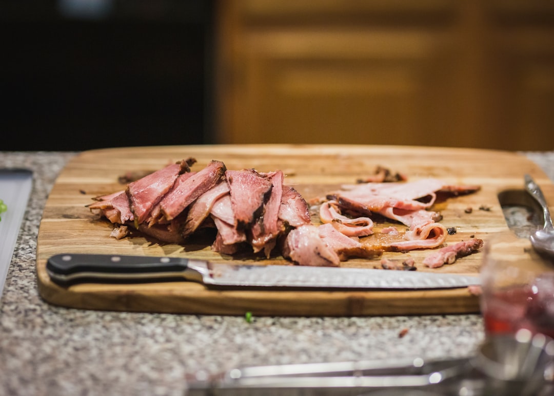 Thin sliced steak on a cutting board