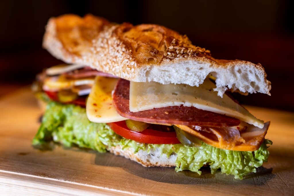 Italian hoagie sandwich with salami, ham, and provolone cheese