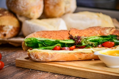 Toasted sub sandwich with melted cheese, lettuce, and tomato