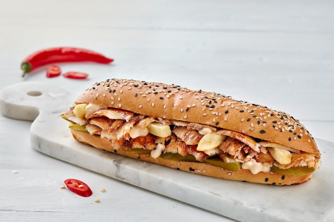 Paisa's cheesesteak sandwich loaded with peppers, onions, and jalapenos
