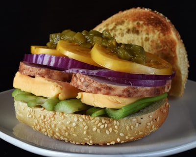 Loaded burger with ham, cheese, onion, and pepper relish