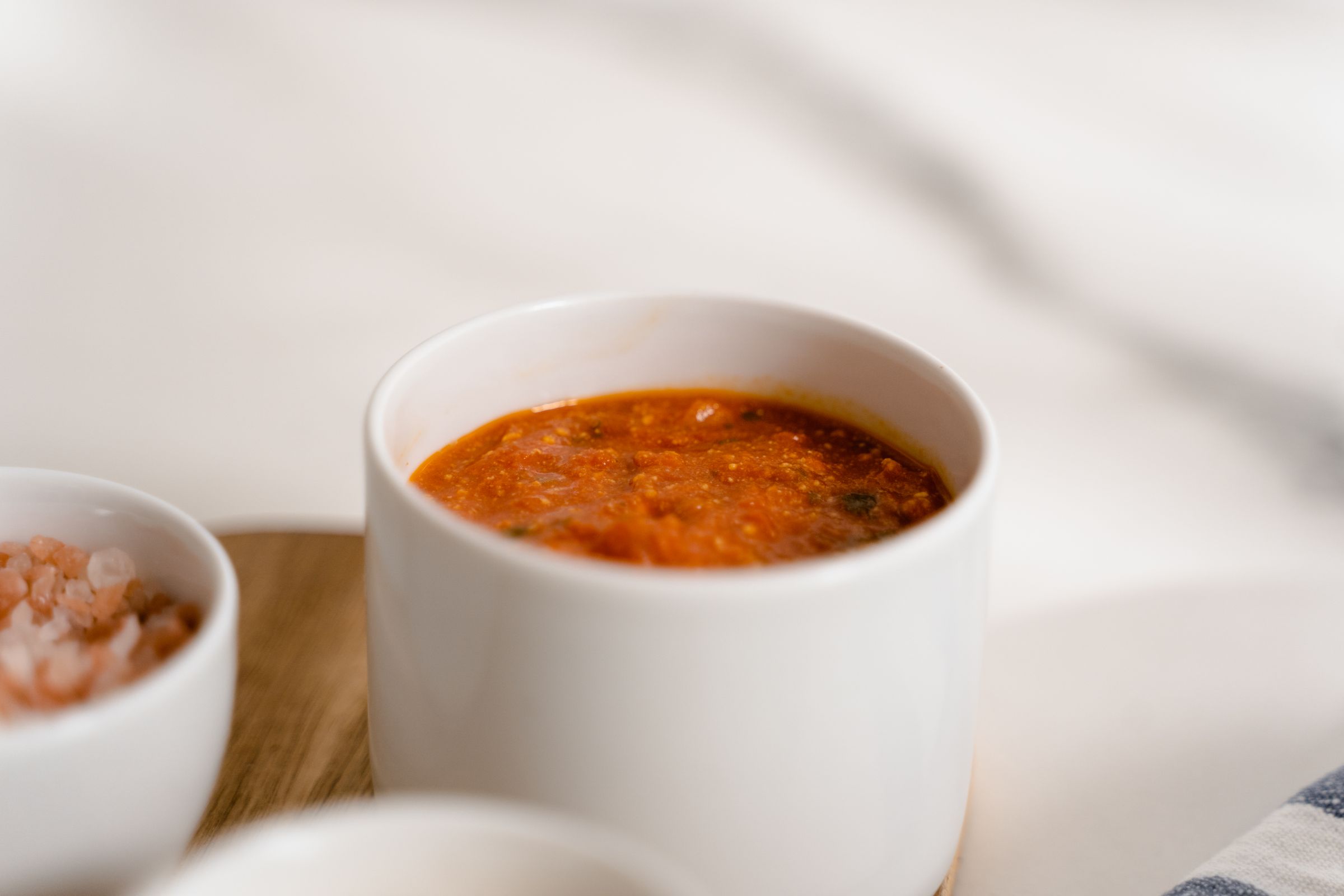 Marinara sauce in a white cup