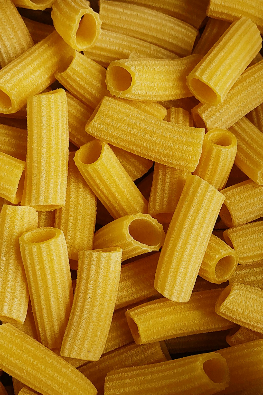 Raw tube-shaped pasta close-up