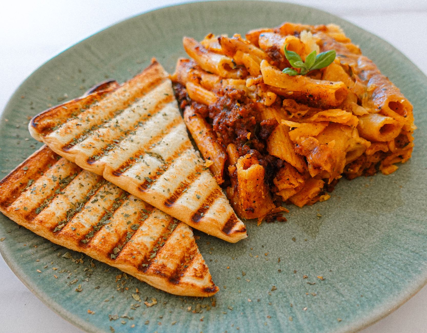 Tube pasta in tomato sauce on a plate