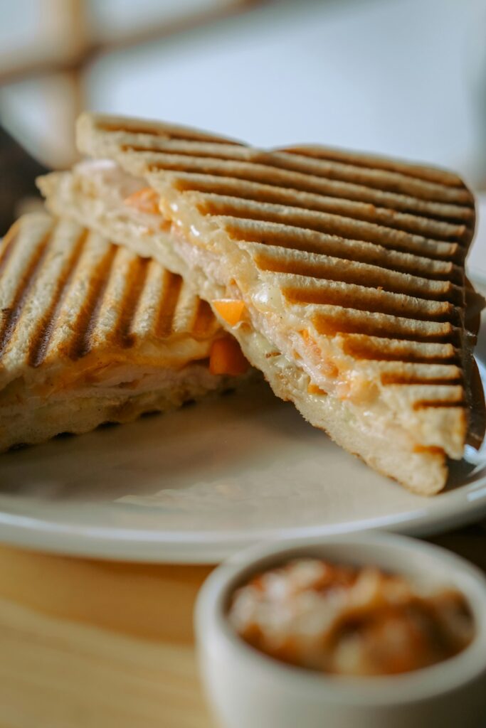 Grilled pizza steak sandwich with melted mozzarella and marinara sauce