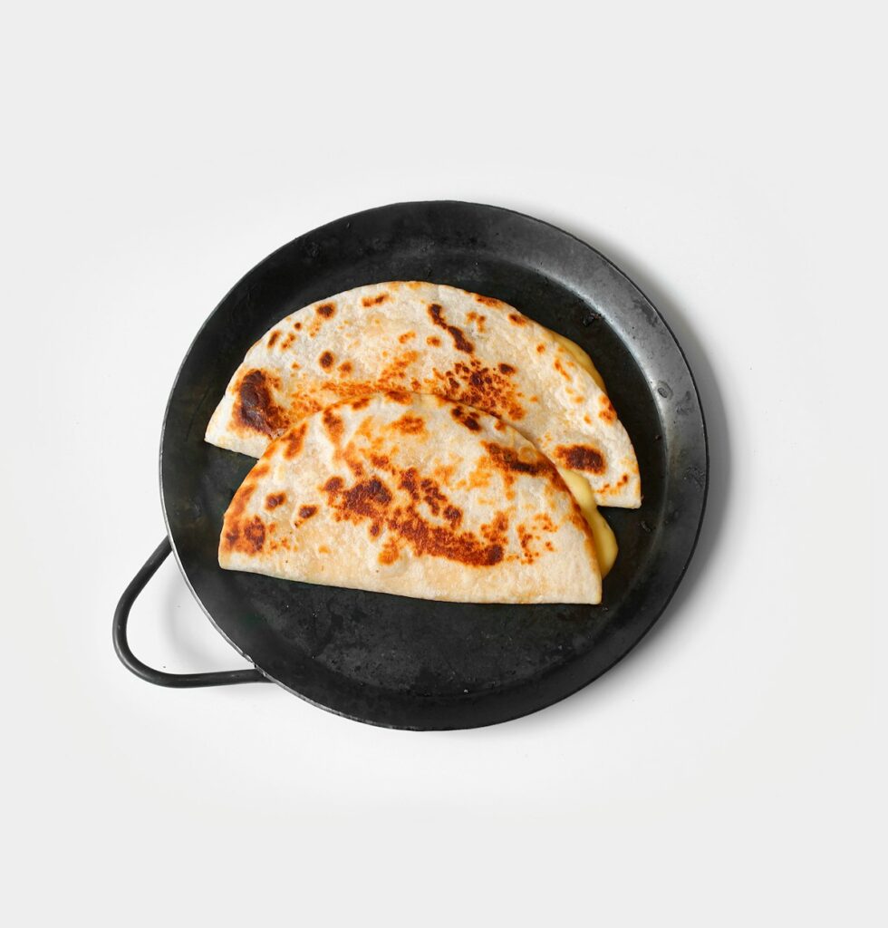 Grilled quesadilla from Paisa's Pizza cut into wedges with melted cheese