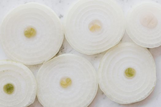 Raw yellow onion sliced into rings