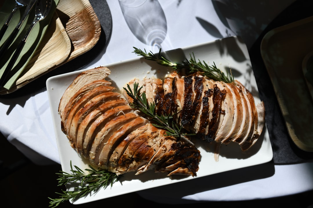 Sliced turkey breast on a white platter