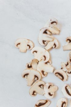Freshly sliced mushrooms on a marble surface