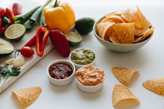 Tortilla chips with salsa and guacamole
