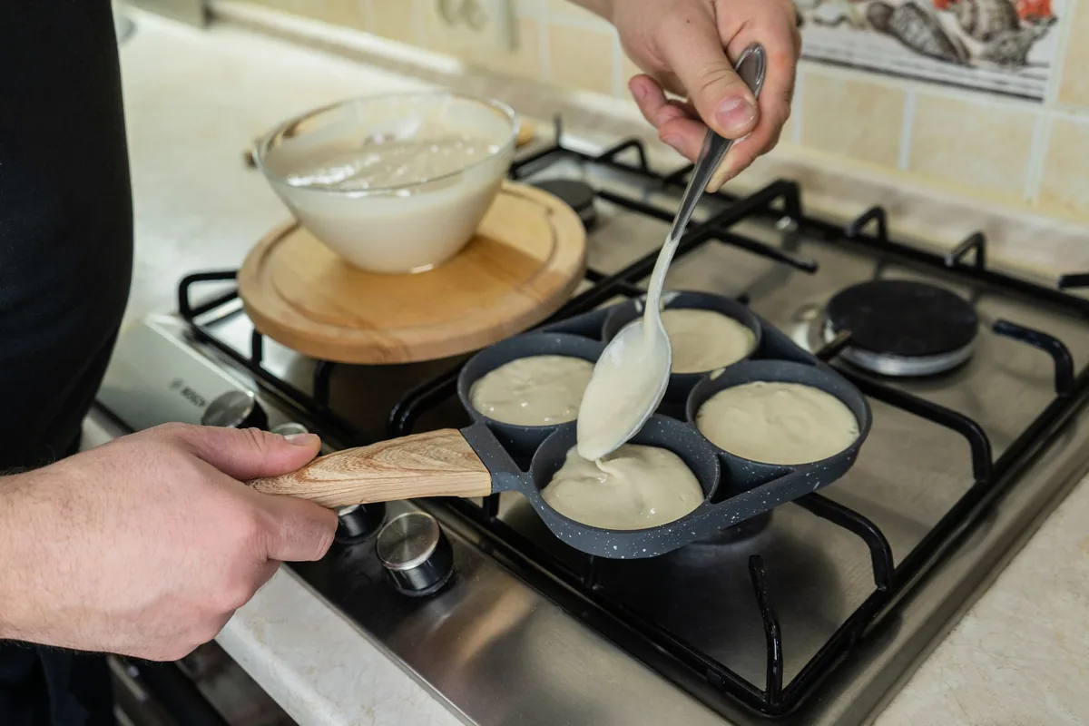 Pancakes cooking in a skillet