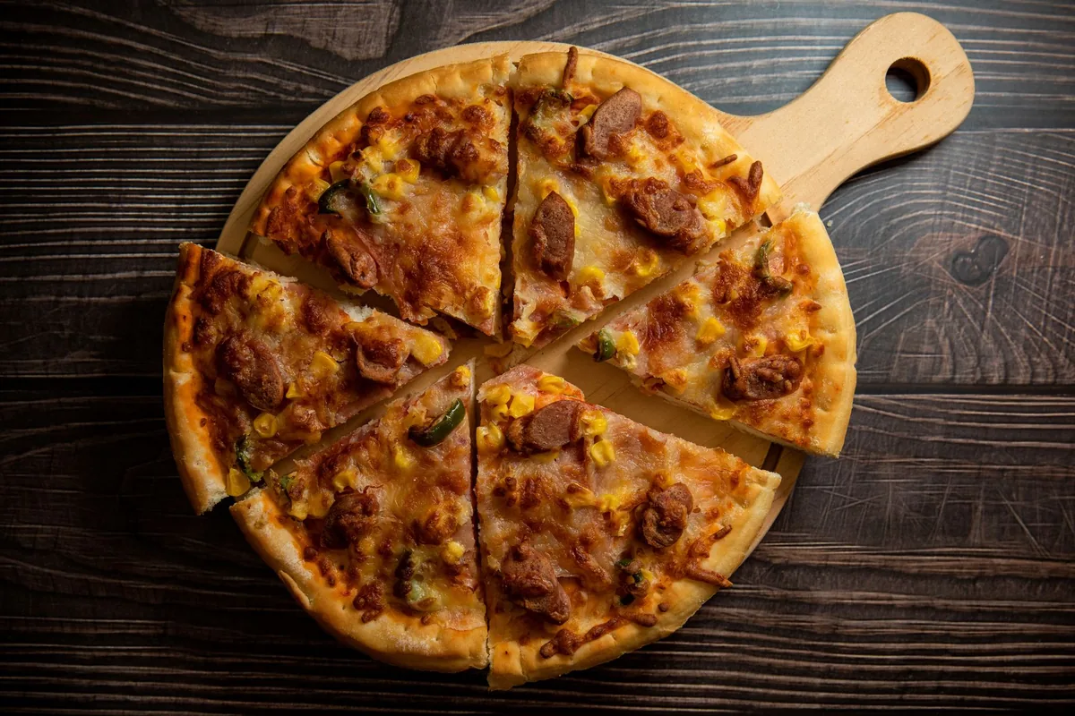 Pizza slices on a wooden board