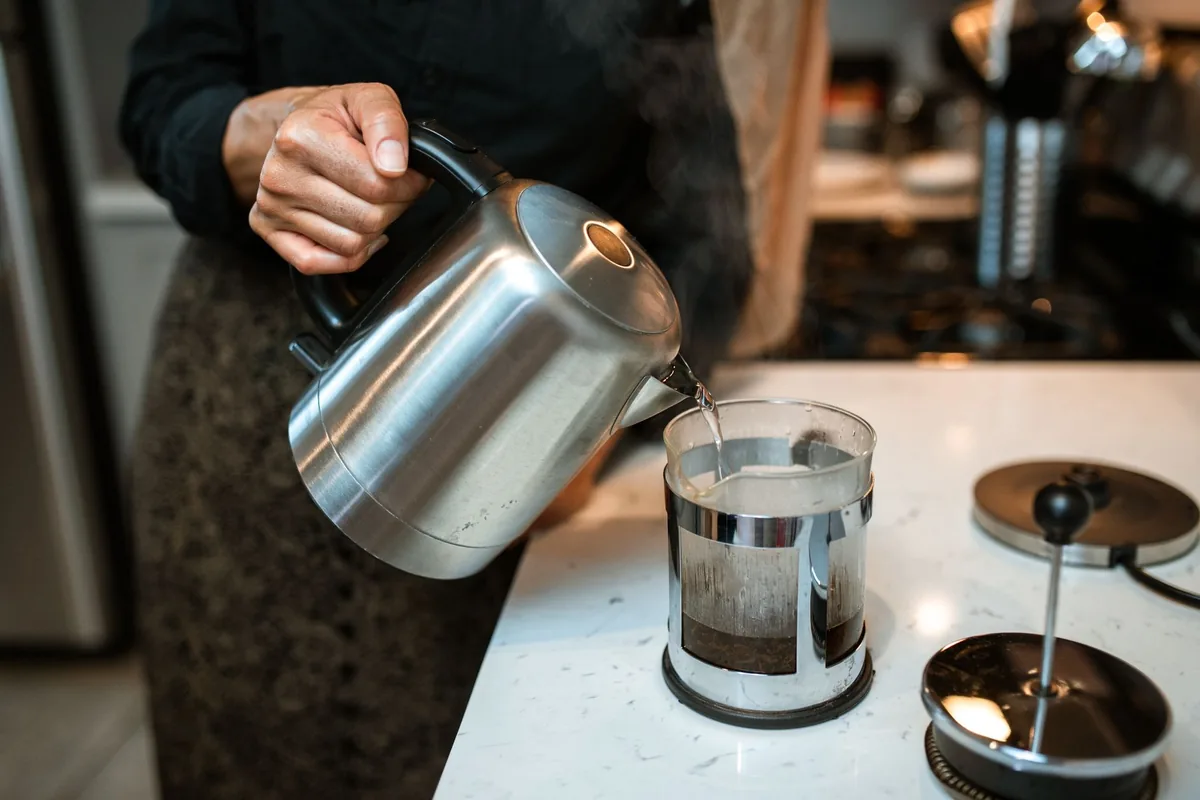 Pouring hot water into a french press