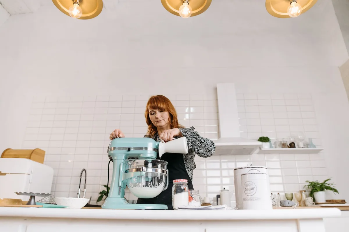 Pouring milk into a stand mixer bowl