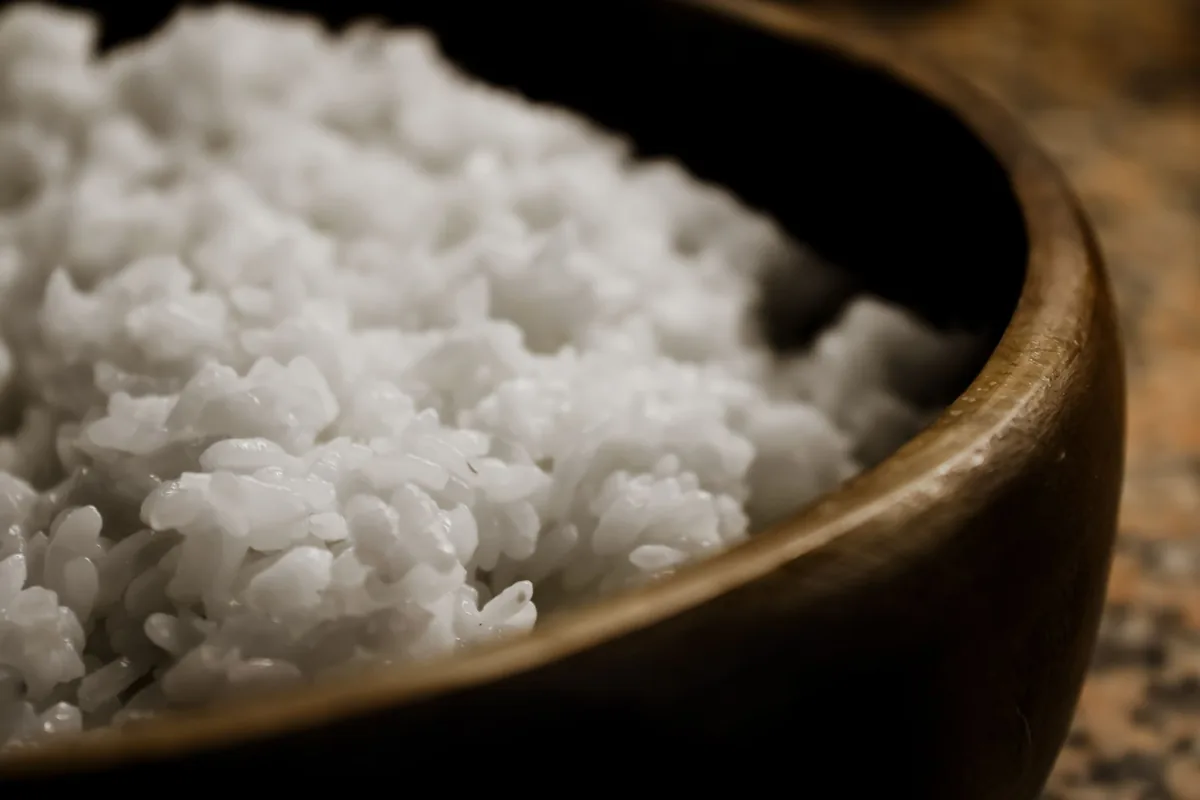 Freshly steamed white rice served in a wooden bowl