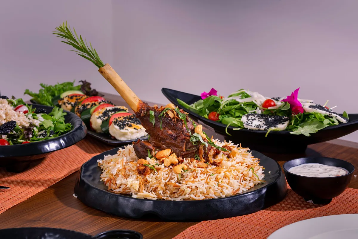 Lamb shank served with biryani rice