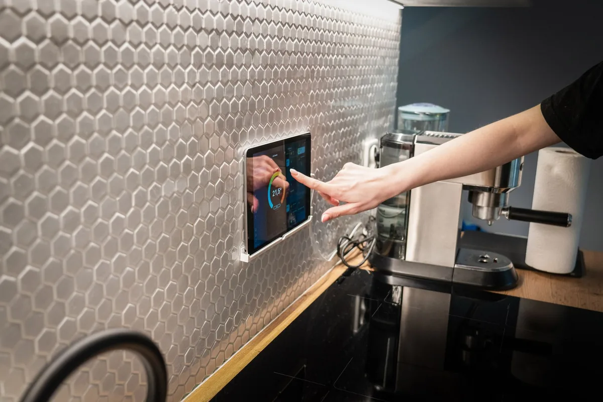 Modern kitchen with a smart home control panel