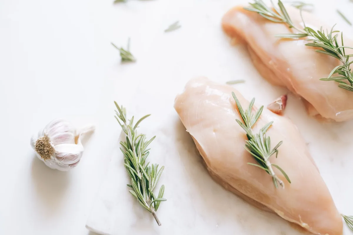 Raw chicken being prepared