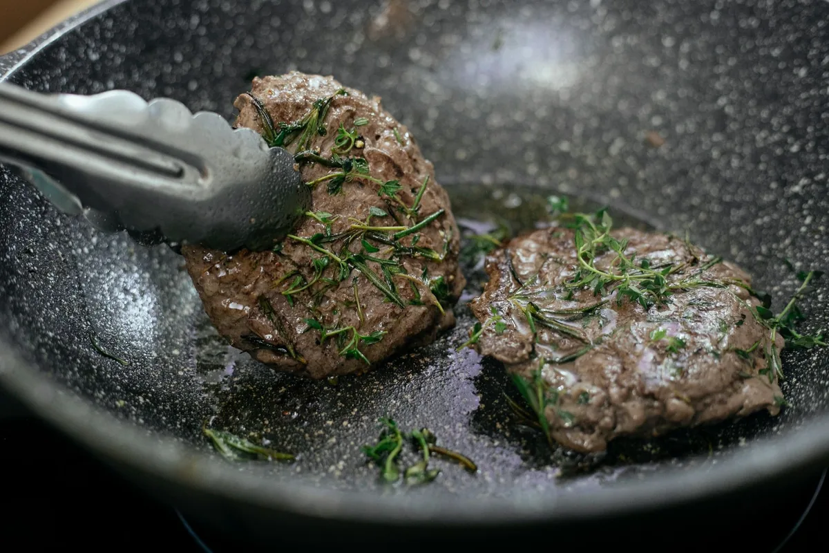 Searing steak in a heavy pan