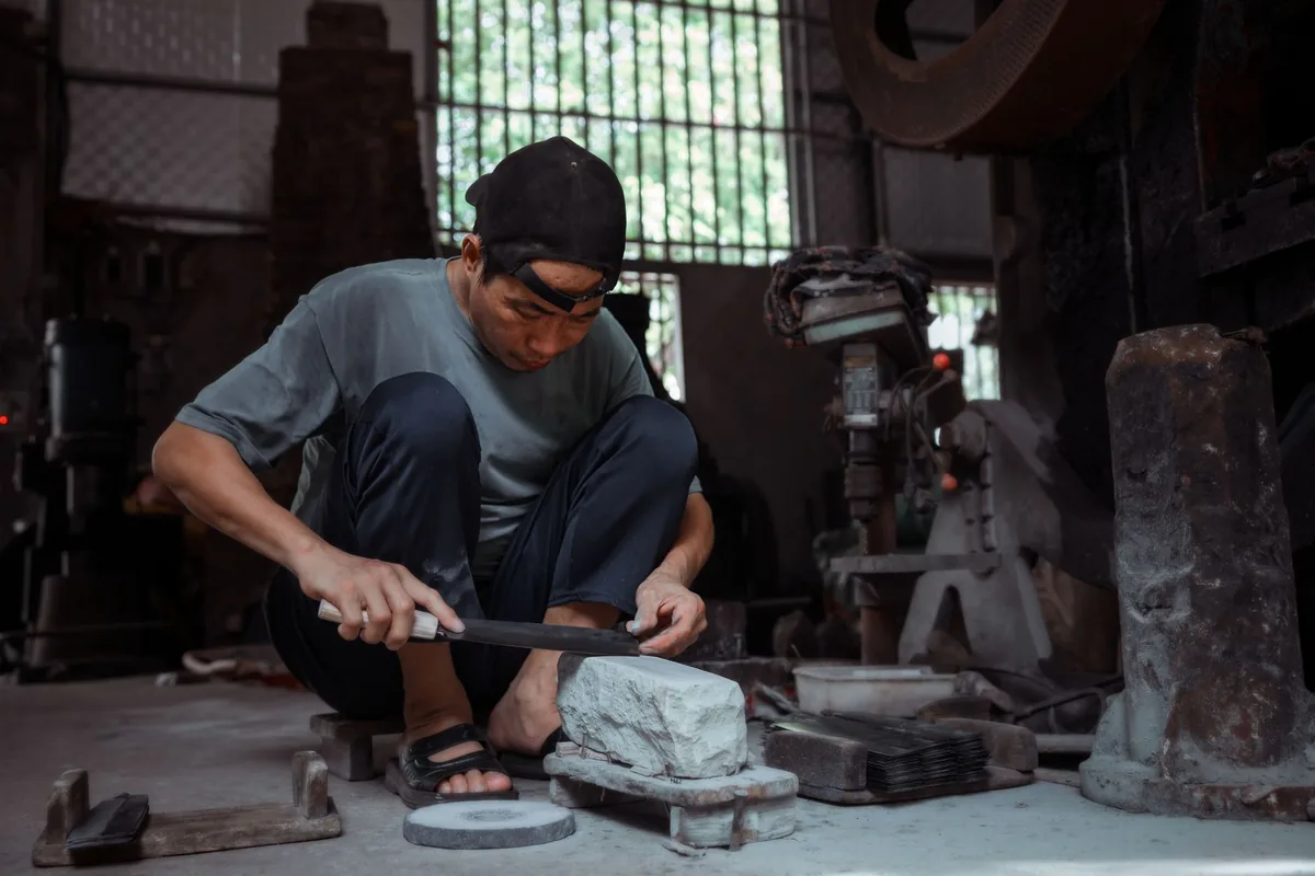 Sharpening a knife blade on a stone