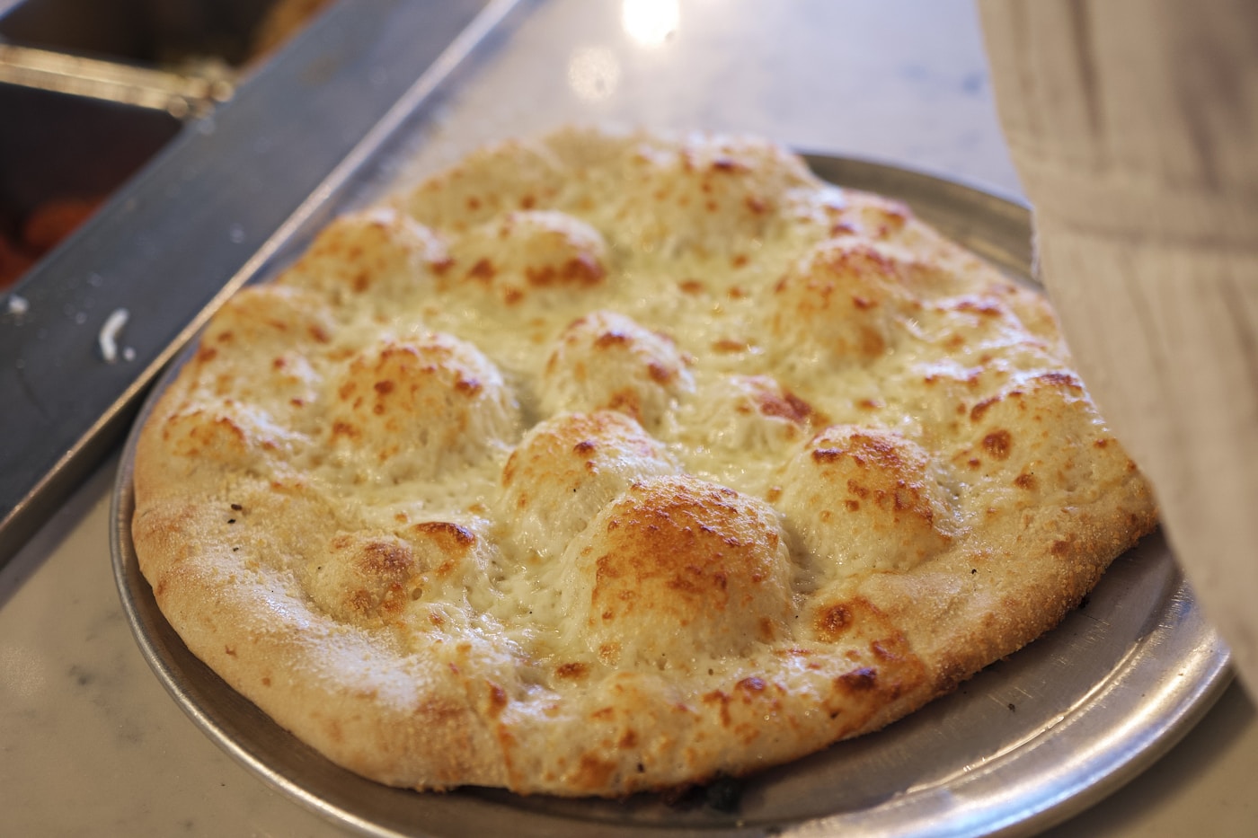 Simple plain white pizza bianca with a golden crust and no toppings