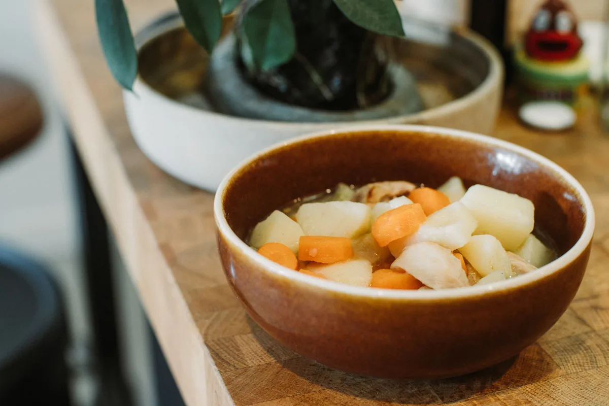 Vegetable stew served in a rustic ceramic bowl