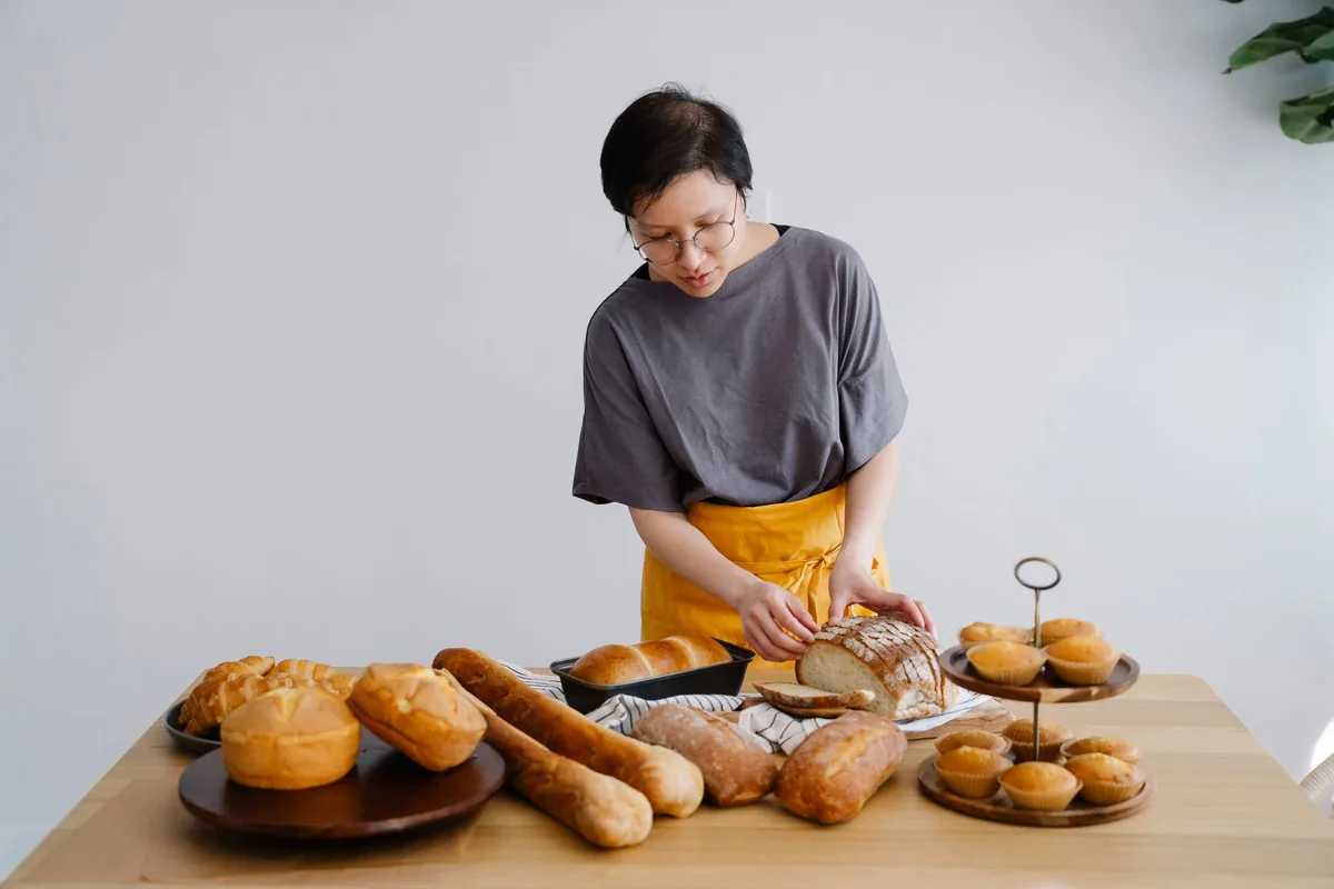 Slicing a freshly baked loaf of bread