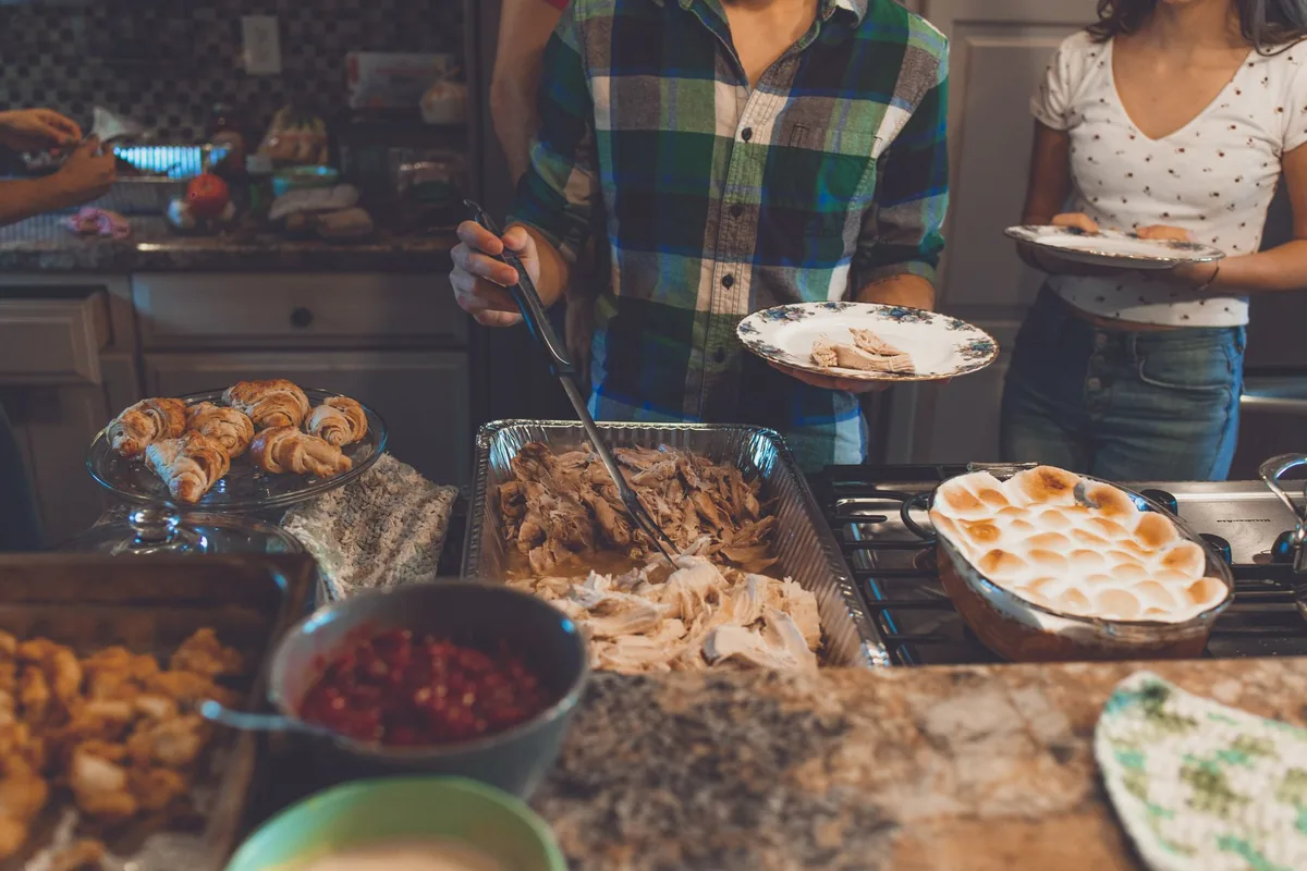 Thanksgiving feast with turkey, rolls and side dishes