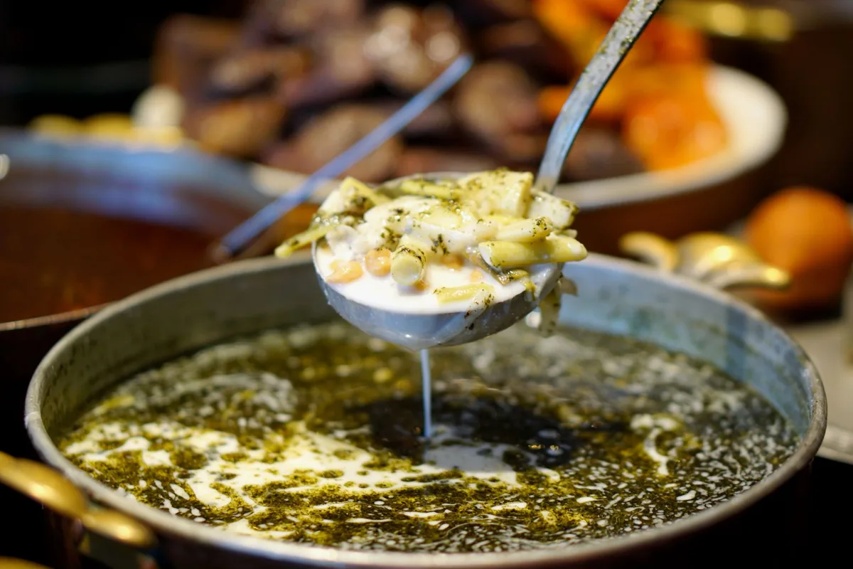 Soup being served at a table