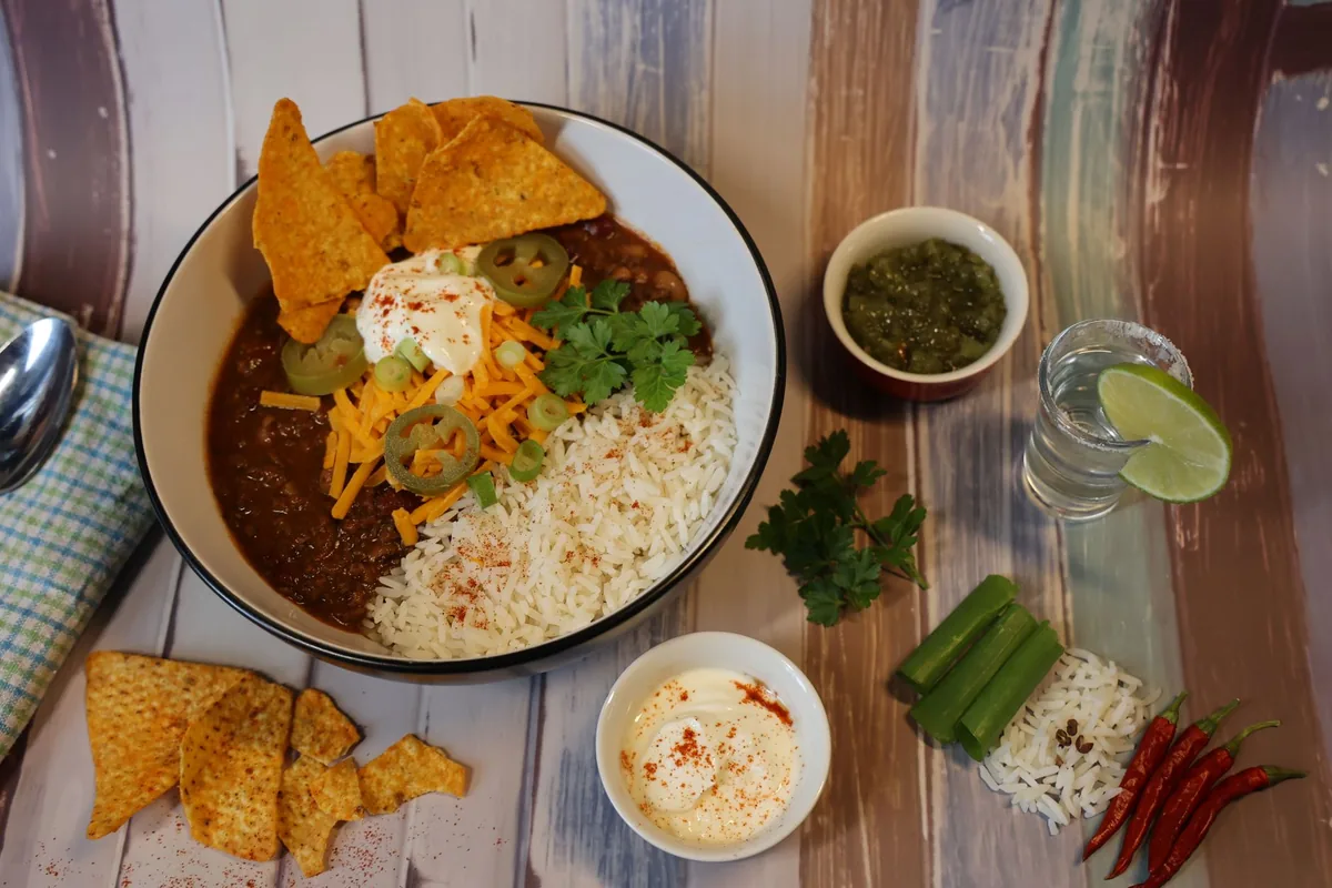 Chili served with rice, nachos and toppings