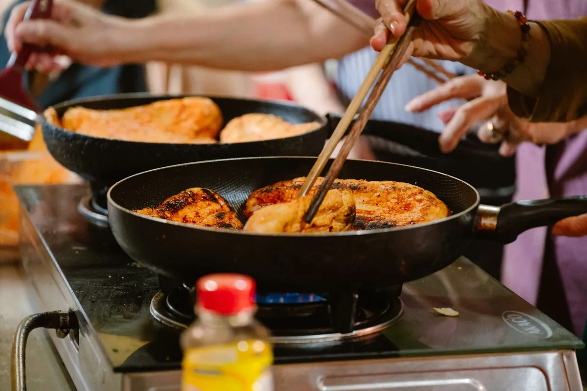 Warm light illuminating a pan on a stovetop
