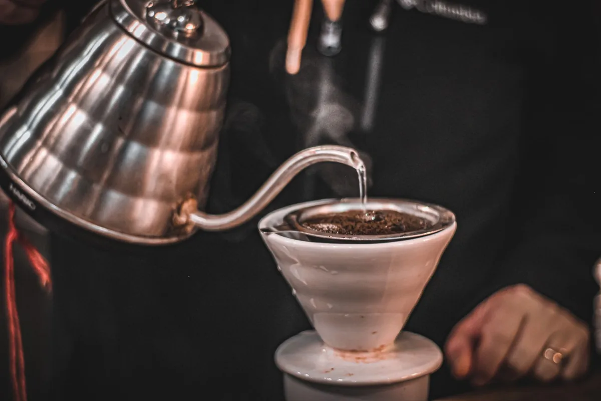 Water poured in a spiral over coffee